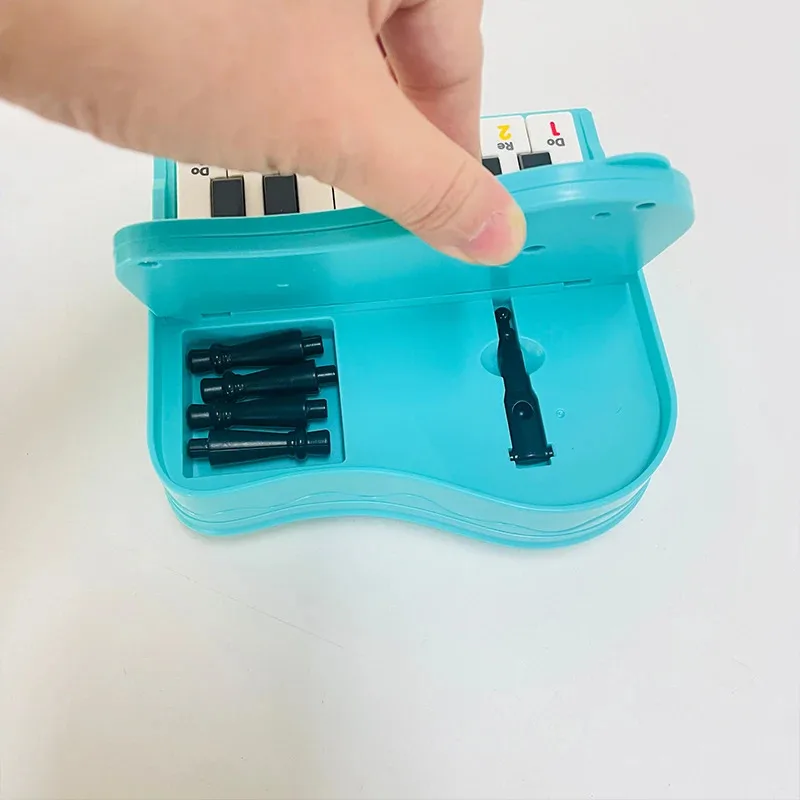 A handheld mini desktop piano with lights, music, electronic keyboard rhythm, and a game console for completing levels; a Montes thumbnail 5
