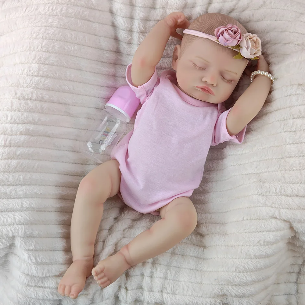 Pink jumpsuit with eyes closed doll