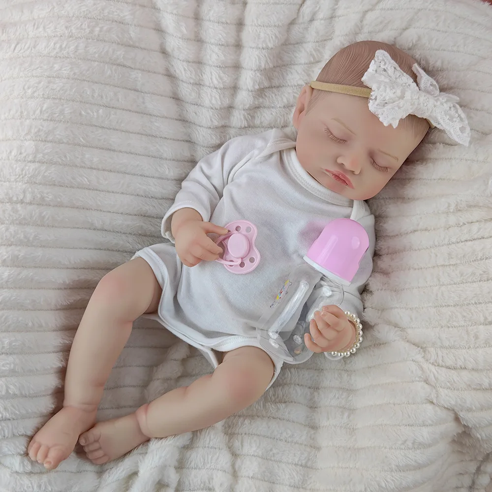 White jumpsuit with eyes closed doll