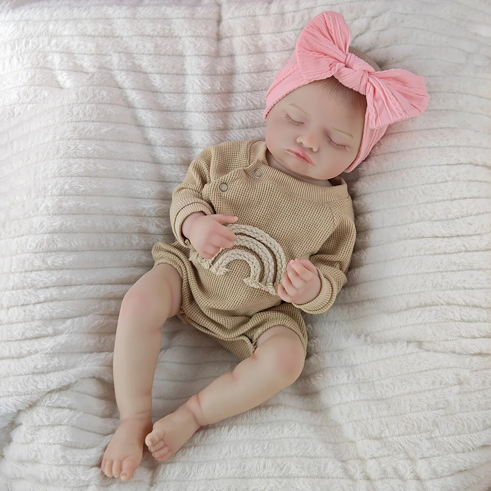 Khaki romper with closed-eye doll